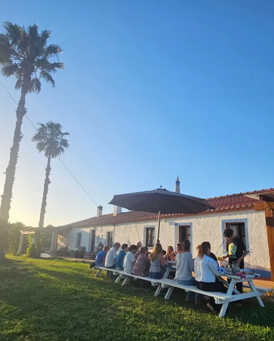 Guests gathered around the picnic table at the farm